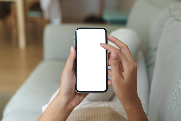 istock close-up hand using phone showing white screen in living room 1420890039