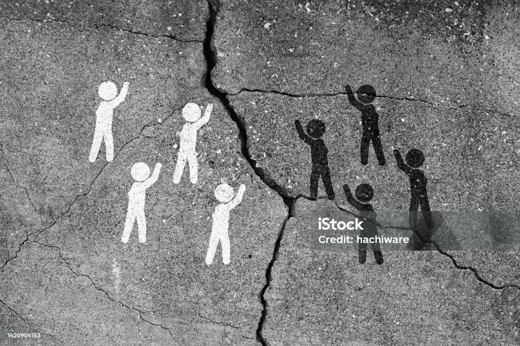 The pictogram of racial conflict. Whites and blacks are bickering and there are cracks between them. Racism Stock Photo