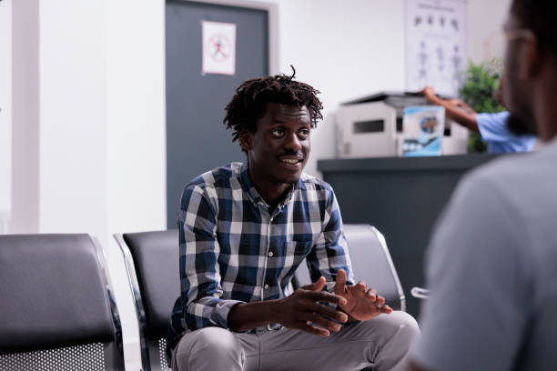 istock Group of people talking in waiting room 1420906586