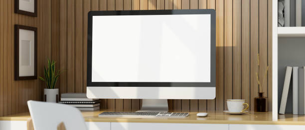 istock Minimal workstation with computer mockup on wood table against the wood plank wall. 1420908068