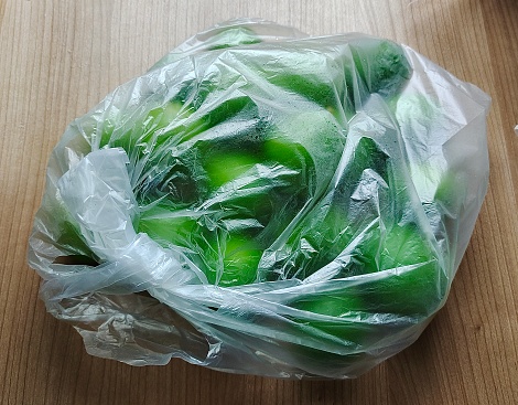 Vegetable and Herb, Fresh and Ripe Lime Fruits in Plastic Bag.