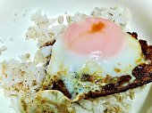 istock Delicious Fried Egg Eating with Rice 1420908458