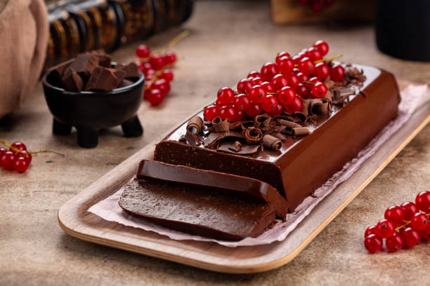 istock Chocolate Pudding Cake or Mousse Jiggly with gelatin and Amaretti, no bake dessert, decorated with red currant. 1420910248