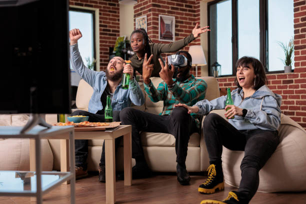 istock Smiling friends feeling cheerful about winning video games 1420910593