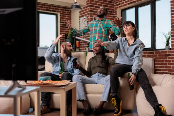 istock Diverse group of friends winning video games with vr headset 1420910635