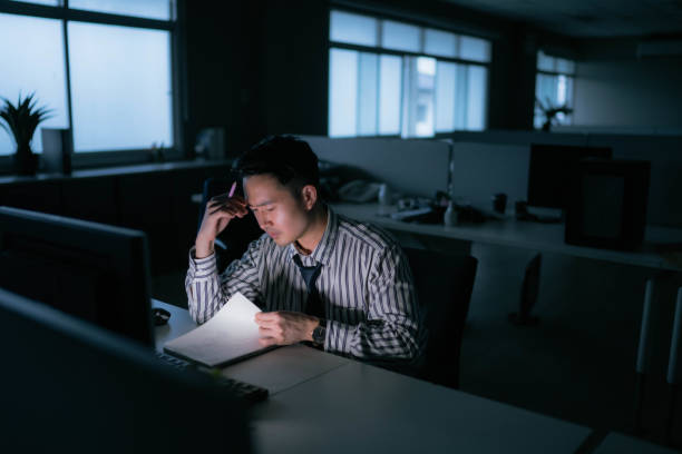 istock Young businessman work late night stress out with project. 1420911507