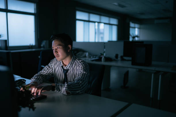 istock Young businessman work late night stress out with project. 1420911540