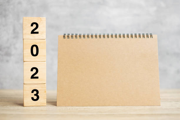 istock 2023 Happy New Year with blank notebook and wooden number. countdown, Resolution, Goals, Plan, Action and Mission Concept 1420915169