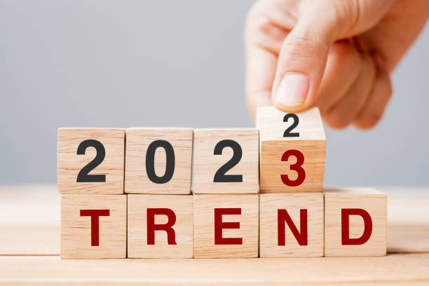 istock hand flipping block 2022 to 2023 TREND text on table. Resolution, idea, goal, motivation, reboot, business and New Year holiday concepts 1420915341