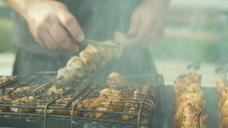 Cooking meat on an open fire.