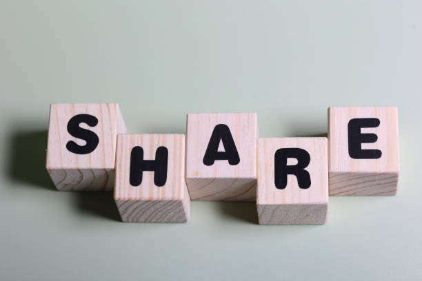 istock Share word on wooden block  on green background 1420919206