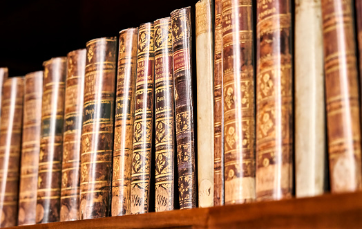 Prague, Czechia, August 29, 2022: Theological writings on a bookshelf in the Maiselova Synygoge in the center of Prague, selective focus