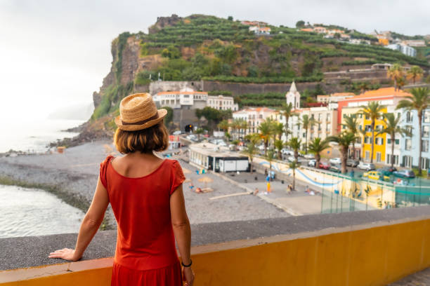A young female tourist on Ponta do Sol Beach in eastern Madeira in summer stock photo