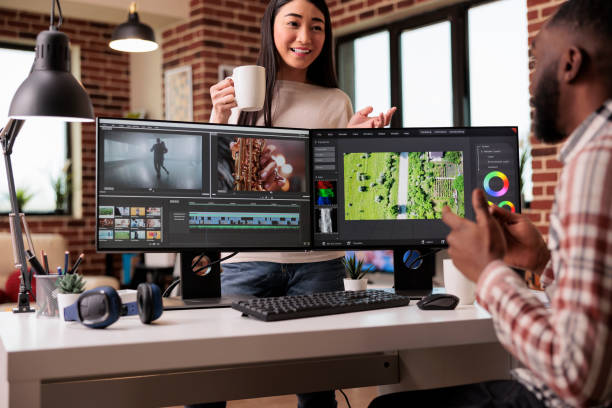 Diverse freelancers editing film footage on computer Diverse freelancers editing film footage on computer, using movie making software with visual and sound effects. Working on post production montage to make creative content on app. photo editing screen stock pictures, royalty-free photos & images
