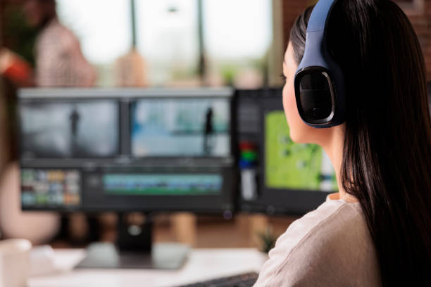 istock Creative videographer editing movie footage 1420927361
