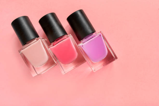 istock Nail polish on pink background 1420930105