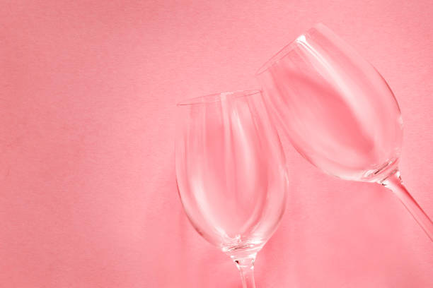 istock Wineglasses on pink background 1420930109