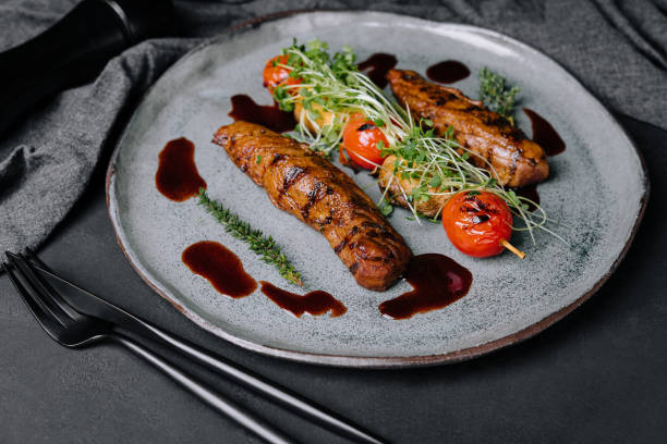 Tasty baked pork tenderloin with grilled vegetables