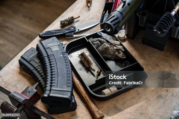 Set Of Tools For Cleaning And Repairing Weapons In Workshop Stock Photo - Download Image Now