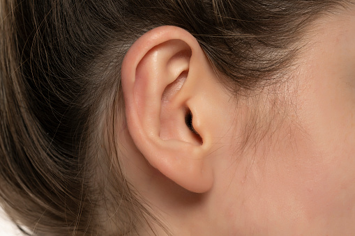 Macro closeup shot of a female ear.
