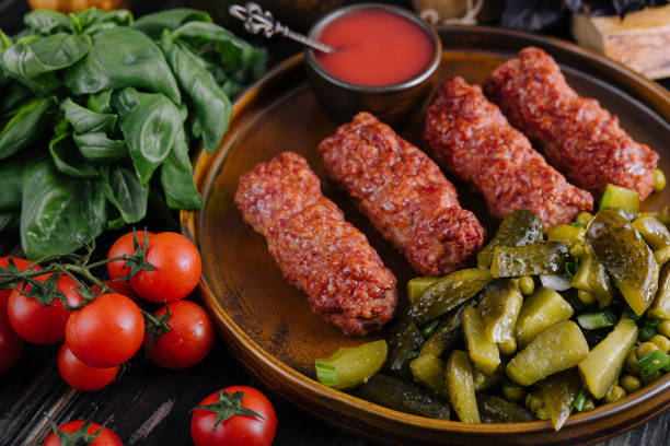 Meat rolls mititei or mici traditional Romanian food stock photo