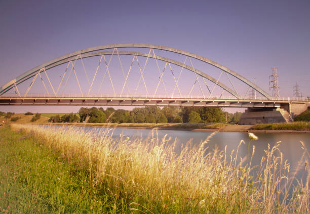 istock metalic bridge over a river at sunset in Belgium 1420937673
