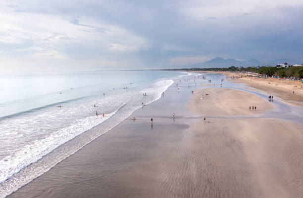 people meeting a sunset on the kuta beach, bali. view from above. - kuta bildbanksfoton och bilder