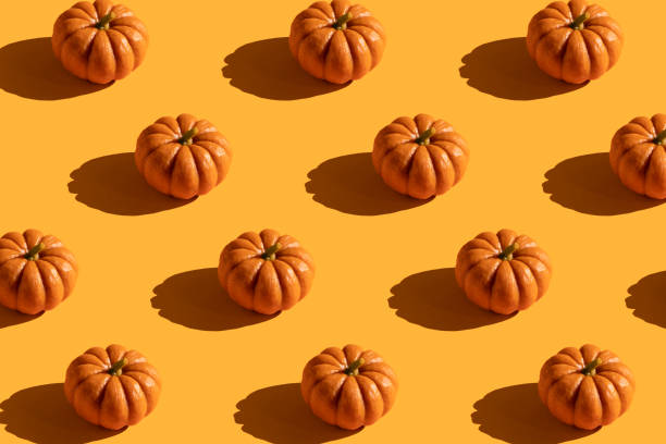istock Pattern of pumpkin on orange background. 1420941934