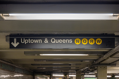 nyc, United States – January 07, 2024: A direction sign at an underground subway station in New York