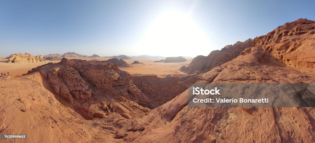 Glimpses of Wadi Rum: desert and red sand at sunset Wadi Rum, the valley carved over millennia by the flow of a river in the sandy soil and granite rock of southern Jordan Absence Stock Photo