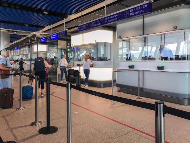 Geneva Airport Passport Control, Switzerland Passengers waiting in line at passport control,  Genava Airport,  Switzerland customs official stock pictures, royalty-free photos & images