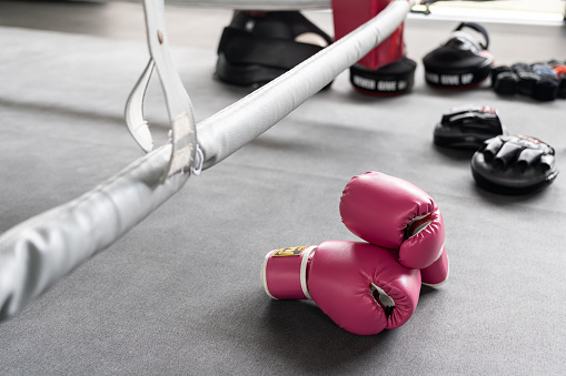 pink boxing gloves for girl and woman fight with copy space.