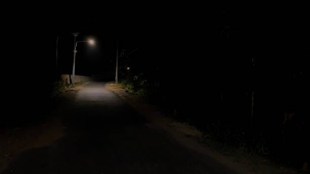 istock Quiet road in the dark night 1420952289