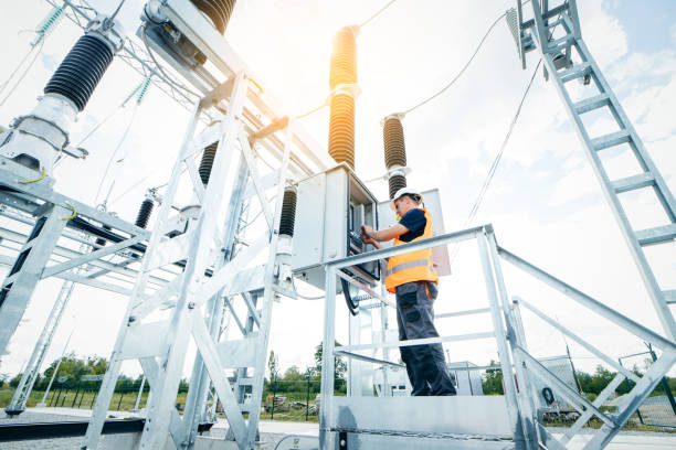 istock Adult electrical engineer inspect the electrical systems at the equipment control cabinet. Installation of modern electrical station 1420952466