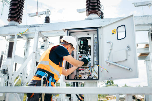 istock Adult electrical engineer inspect the electrical systems at the equipment control cabinet. Installation of modern electrical station 1420952743