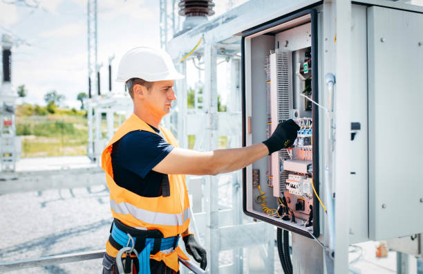 istock Adult electrical engineer inspect the electrical systems at the equipment control cabinet. Installation of modern electrical station 1420952755