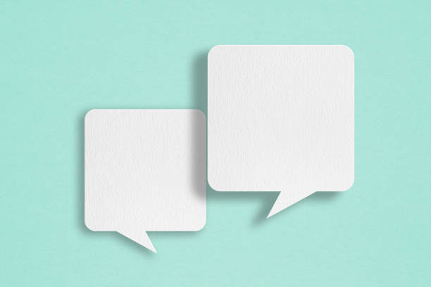 istock two blank white speech bubble   paper cut, on grunge blue paper background. Conceptual image about communication and social media 1420953090