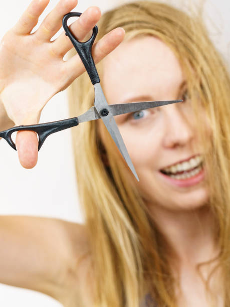 istock Woman with scissors ready to hair cutting 1420955806