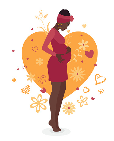 Happy Pregnant African Woman holding her belly.
