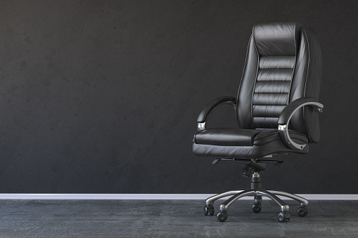 Black office chair in black interior with space for text. 3d illustration