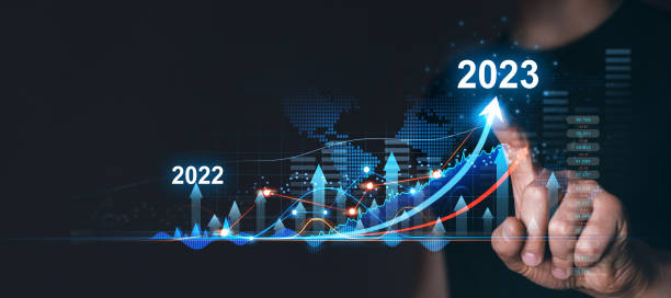 Businessman draws increase arrow graph corporate future growth year 2022 to 2023. Planning,opportunity, challenge and business strategy. stock photo