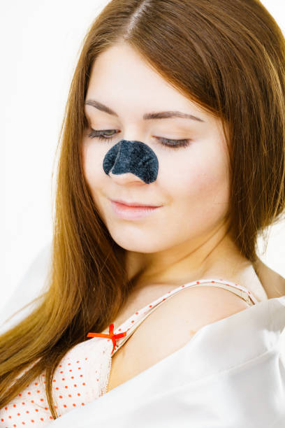 Woman with nose mask pore strips stock photo