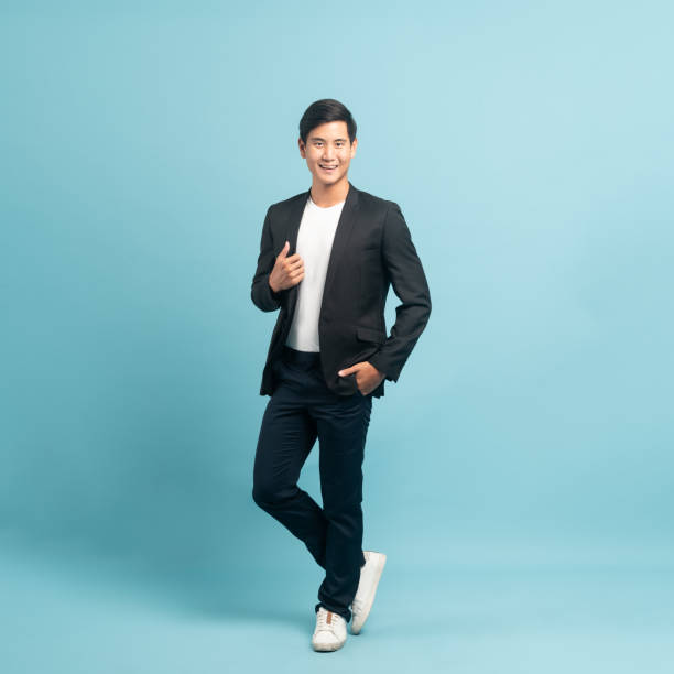 istock Good looking businessman portrait isolated on blue background 1420961989