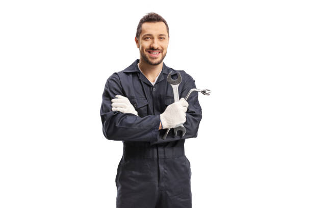 istock Car mechanic holding a wrench and a key tool 1420967979