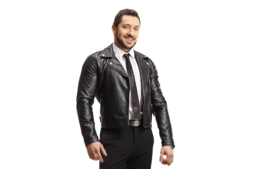Handsome young man in a leather jacket isolated on white background