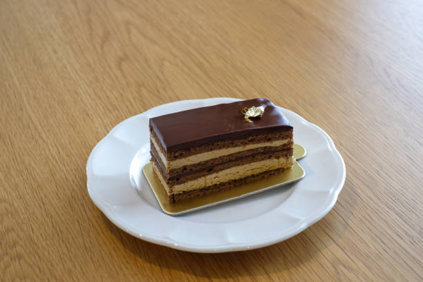istock opera cake on white dish. Homemade bakery concept. 1420972099