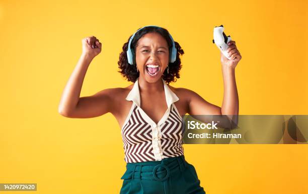 Winning Celebration And Gaming Woman Happy About Success In Video Game On Yellow Mockup Studio Background Portrait Of Excited Happy And Motivation Face Of African Gamer Of Online Competition Stock Photo - Download Image Now