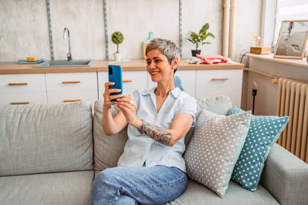 istock Senior Woman Taking A Selfie At Home 1420974425