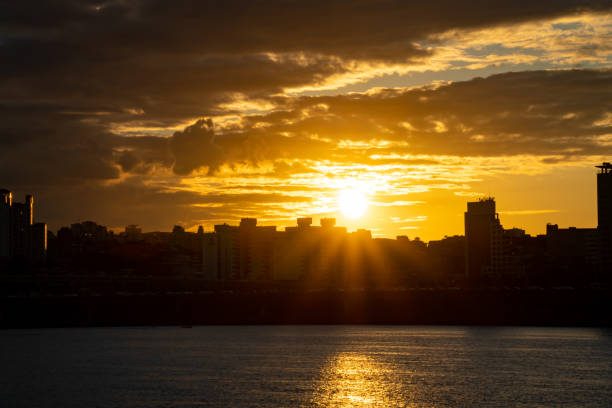 Sun is disappearing under the city