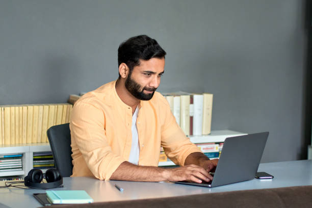 istock Indian business man professional manager using laptop computer in office. 1420975126